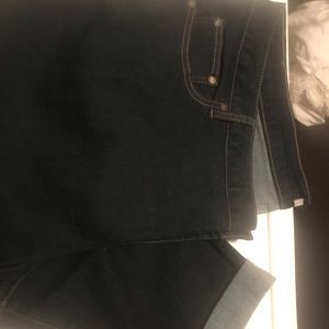 Woman within dark wash jeans